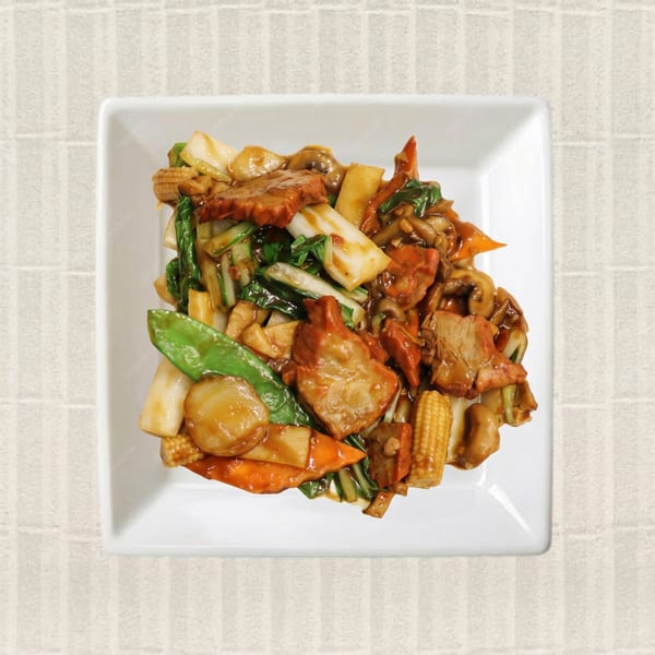 Overhead view of a white square plate filled with stir-fried pork, vegetables, and baby corn.